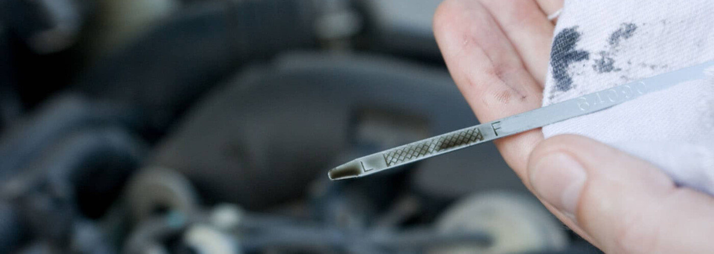 Checking oil level on dipstick