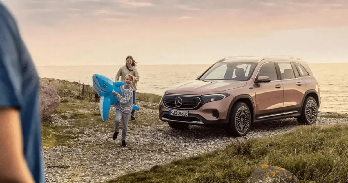 Family next to Mercedes-Benz SUV