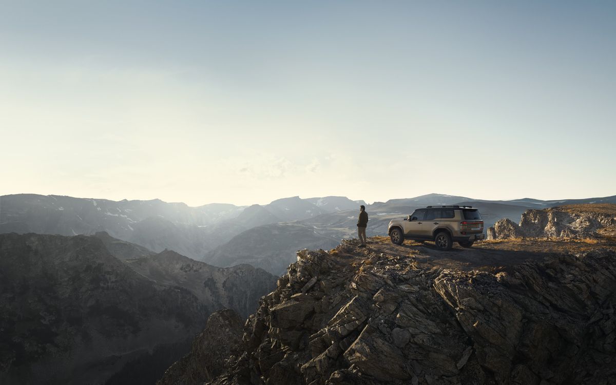 2026 Lexus GX parked overlooking a mountain vista at sunset