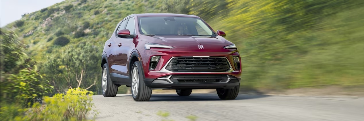 red 2024 Buick Encore driving on a road
