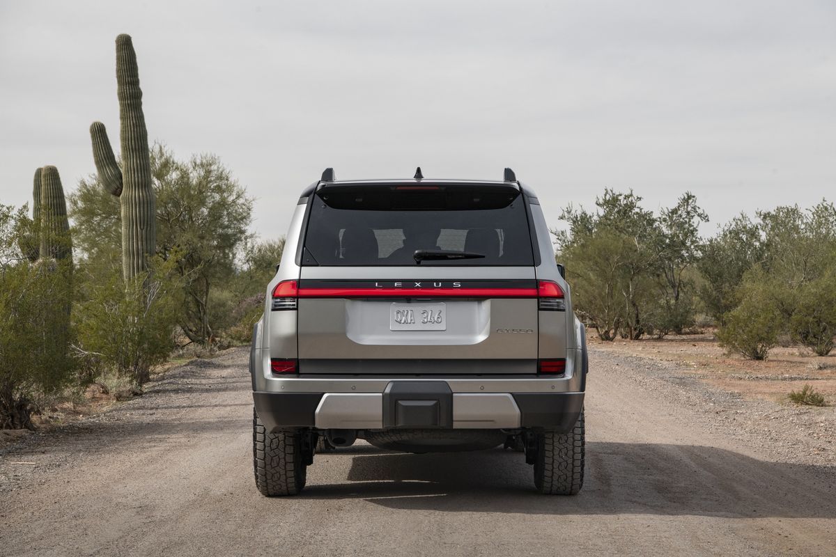 2026 Lexus GX 550 Overtrail+ rear view showing the GX 550 badge on a dirt road