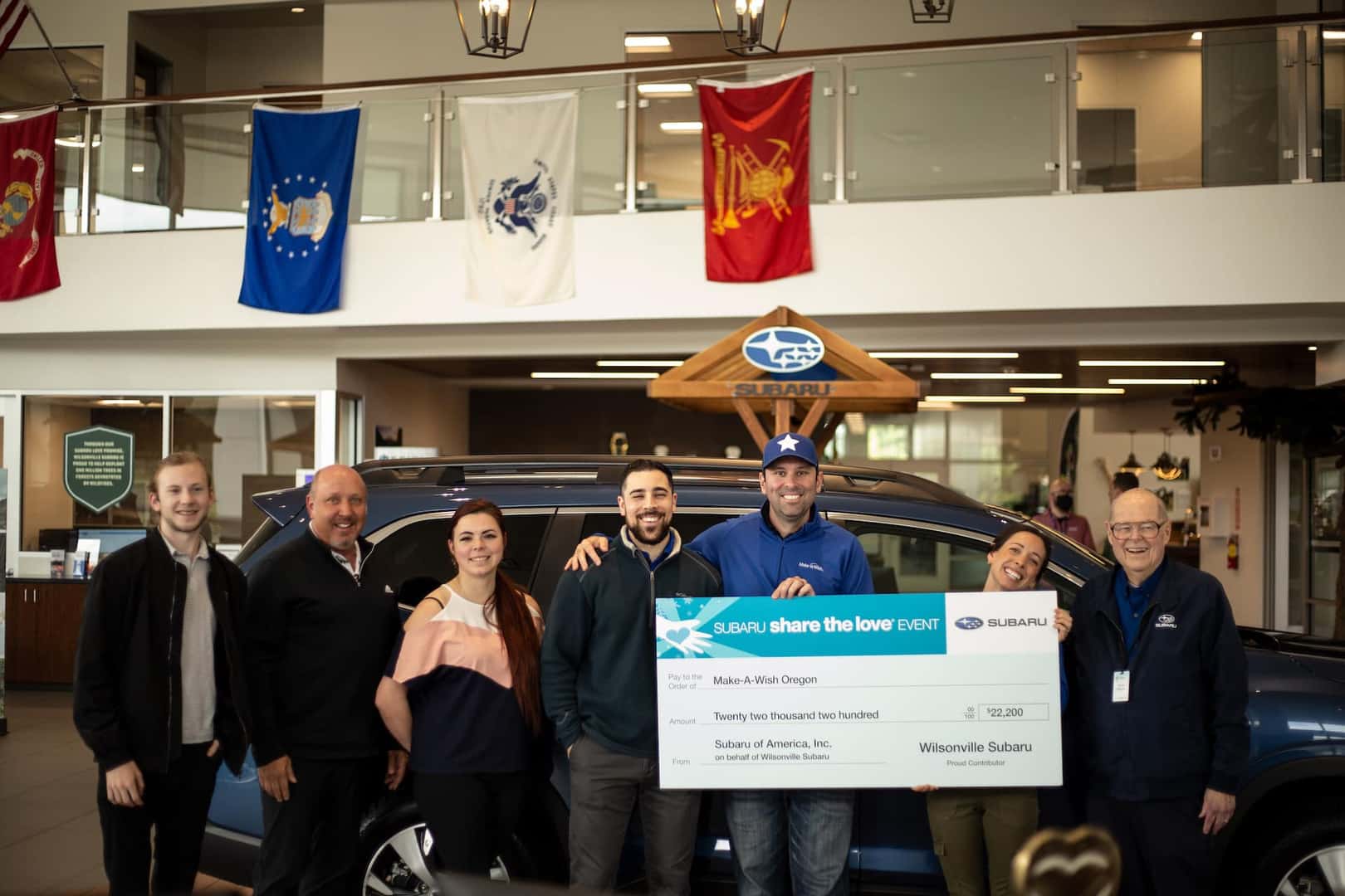 Wilsonville Subaru team presenting a Share the Love check to Victory Academy