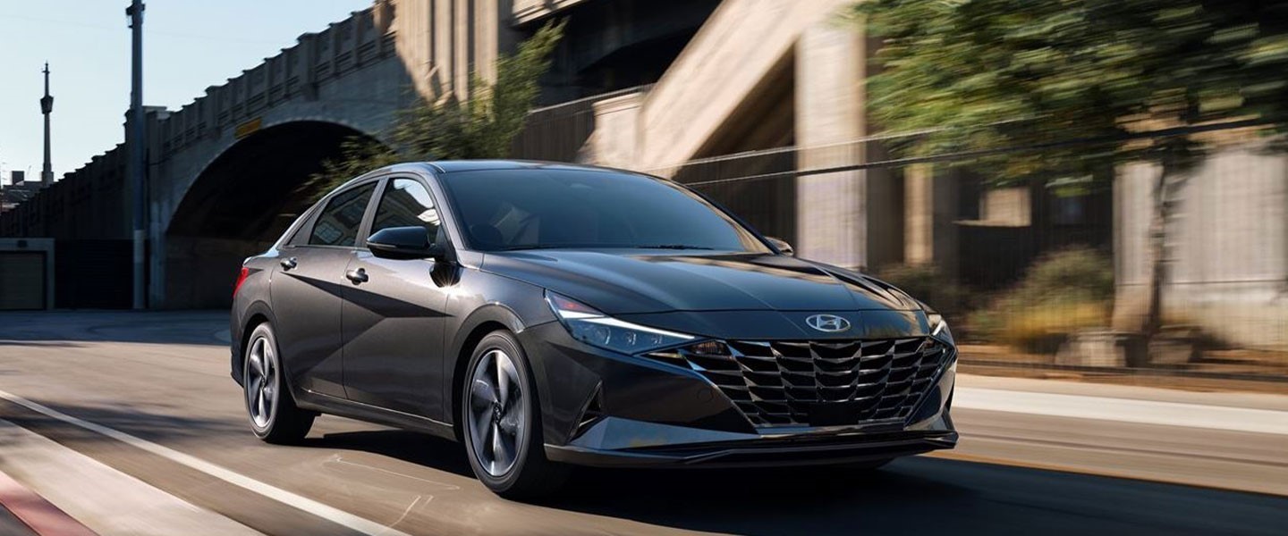 The 2022 Hyundai Elantra driving on the road.
