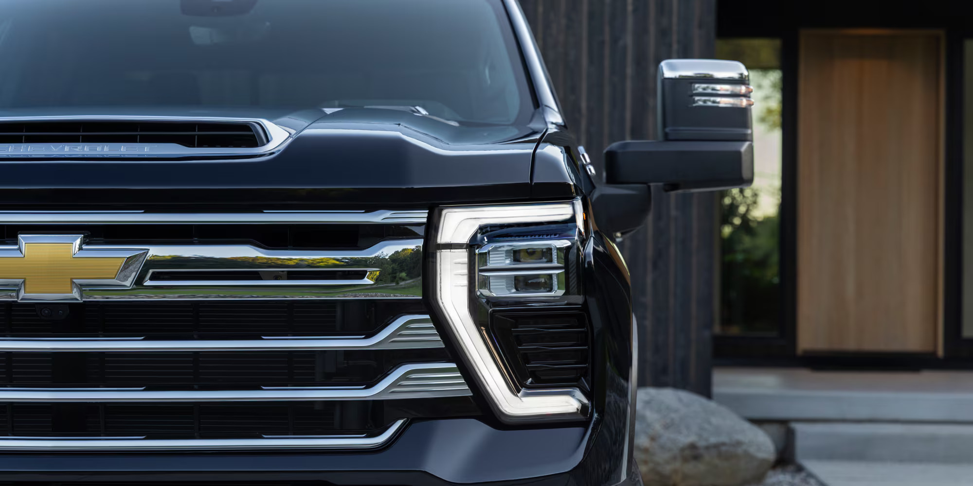 A black truck sitting parked.