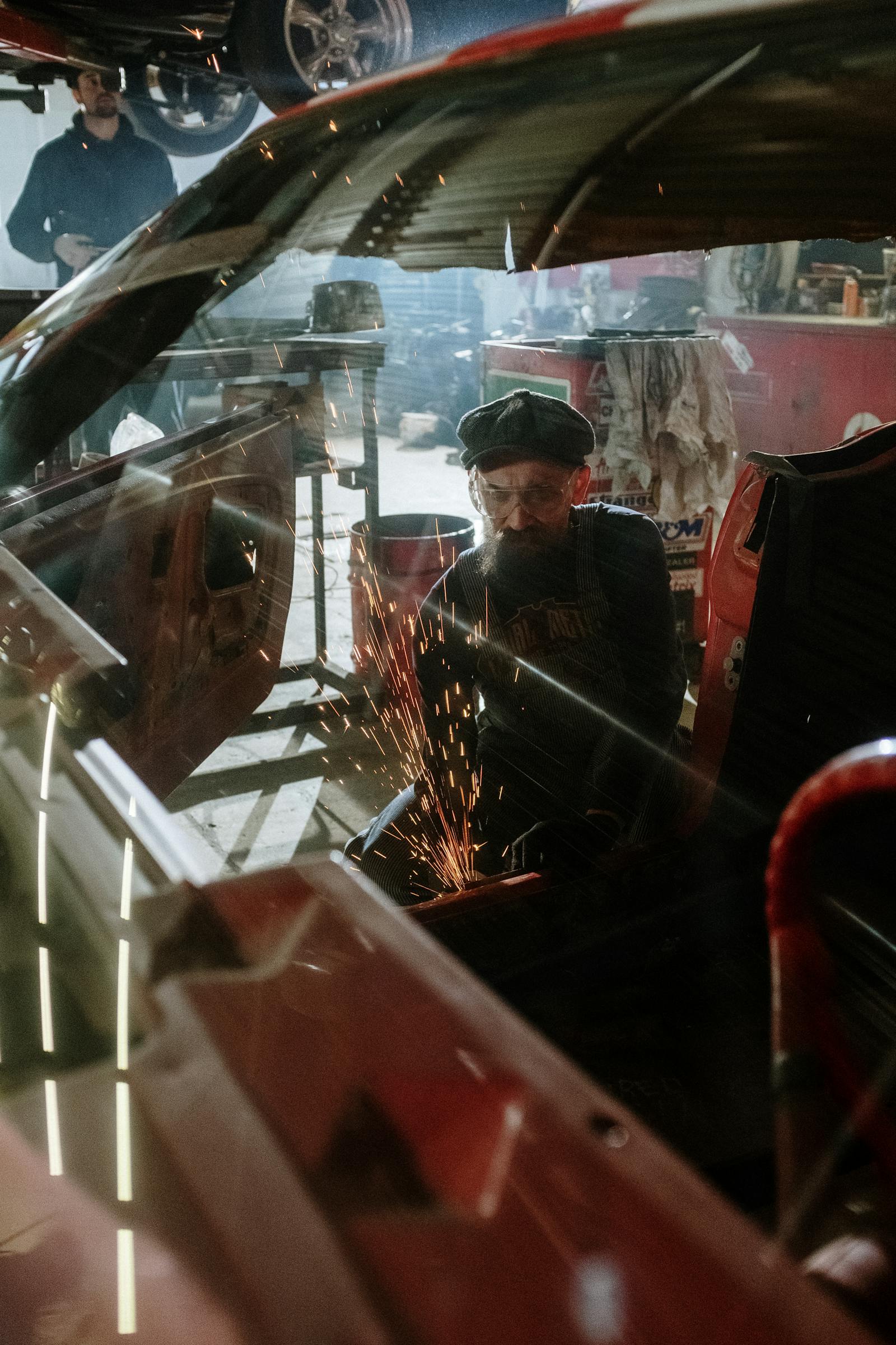 Ford service technician working in service bay at Kunes Ford of Sterling