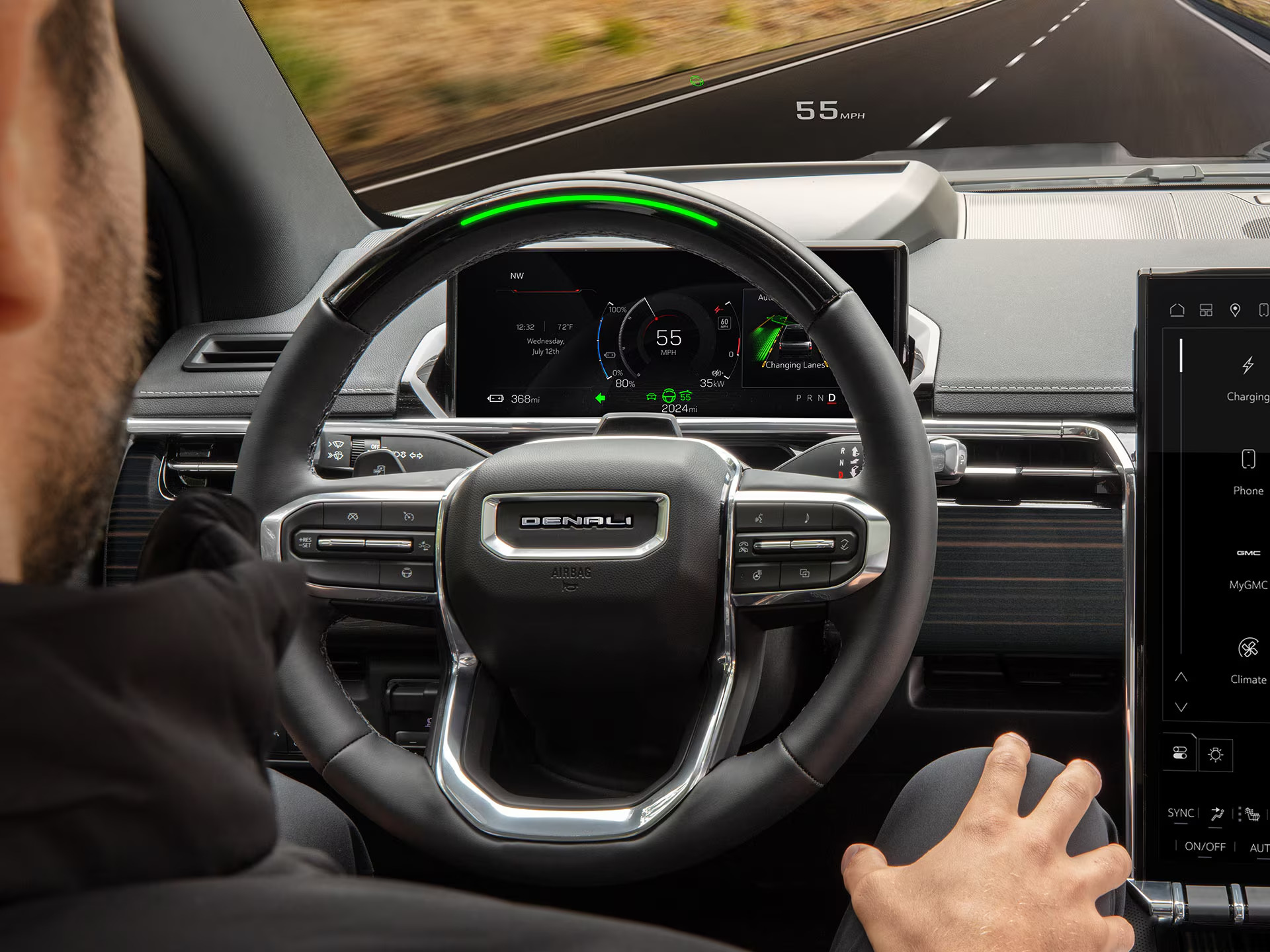 GMC Sierra EV Denali interior with Super Cruise active and the steering wheel light bar lit green