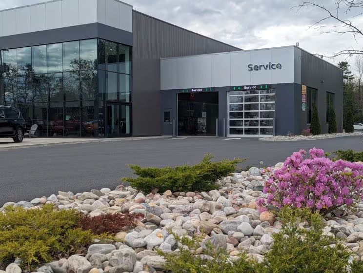 Homepage section showing Nissan SUVs equipped with roof racks and accessories, promoting genuine Nissan accessories and inviting customers to shop accessories to customize and protect their vehicle.