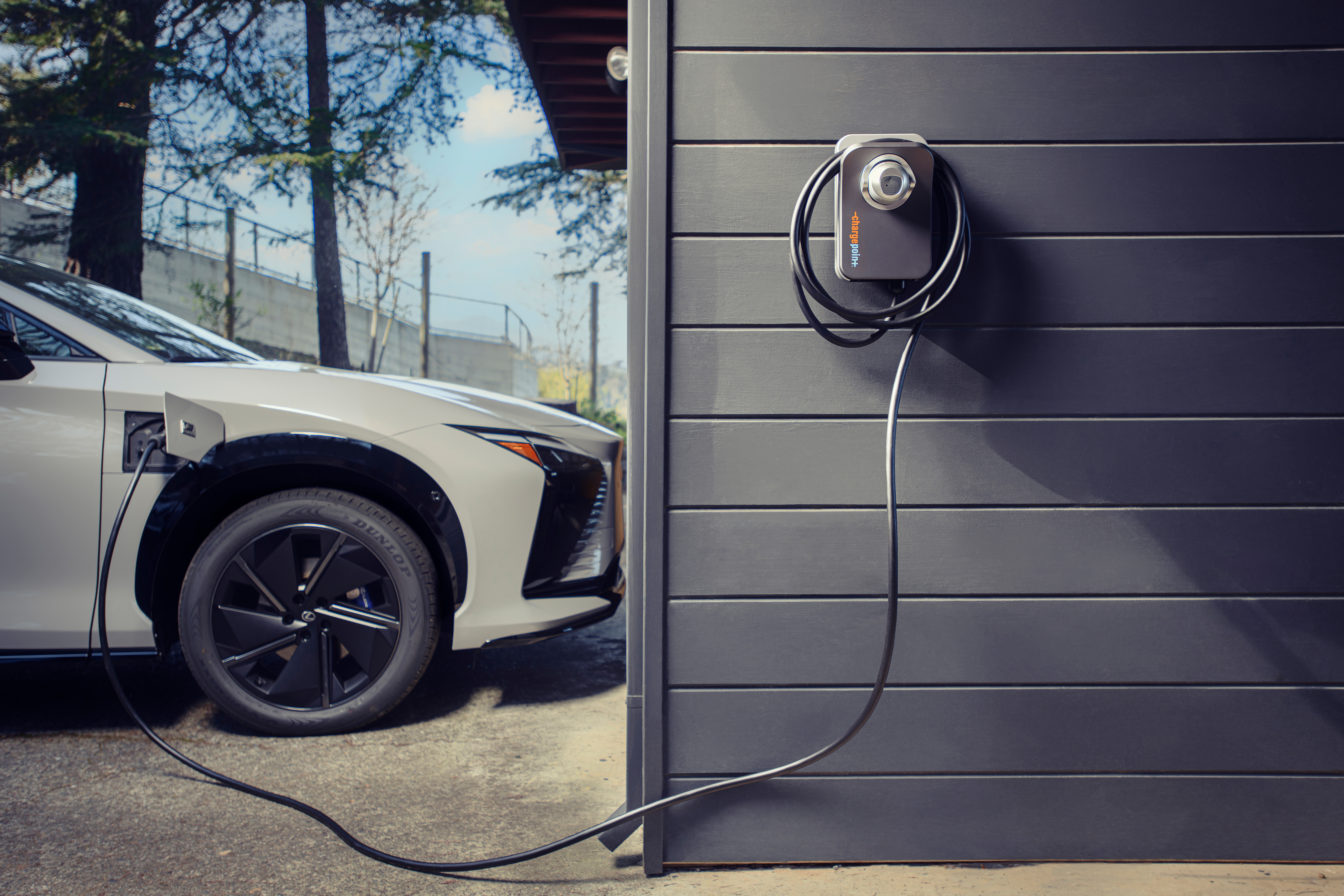 Lexus TX 550h Plus shown in Wind Chill Pearl.