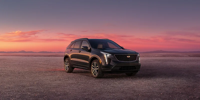 2023 Cadillac XT4 with a sunset in the background