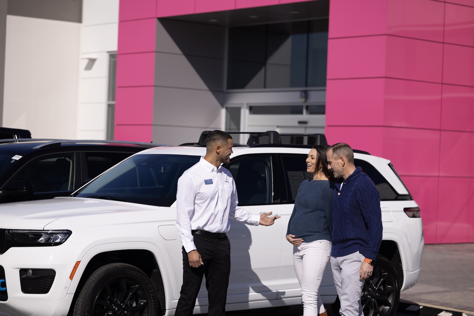 Couple walking up to sales associate