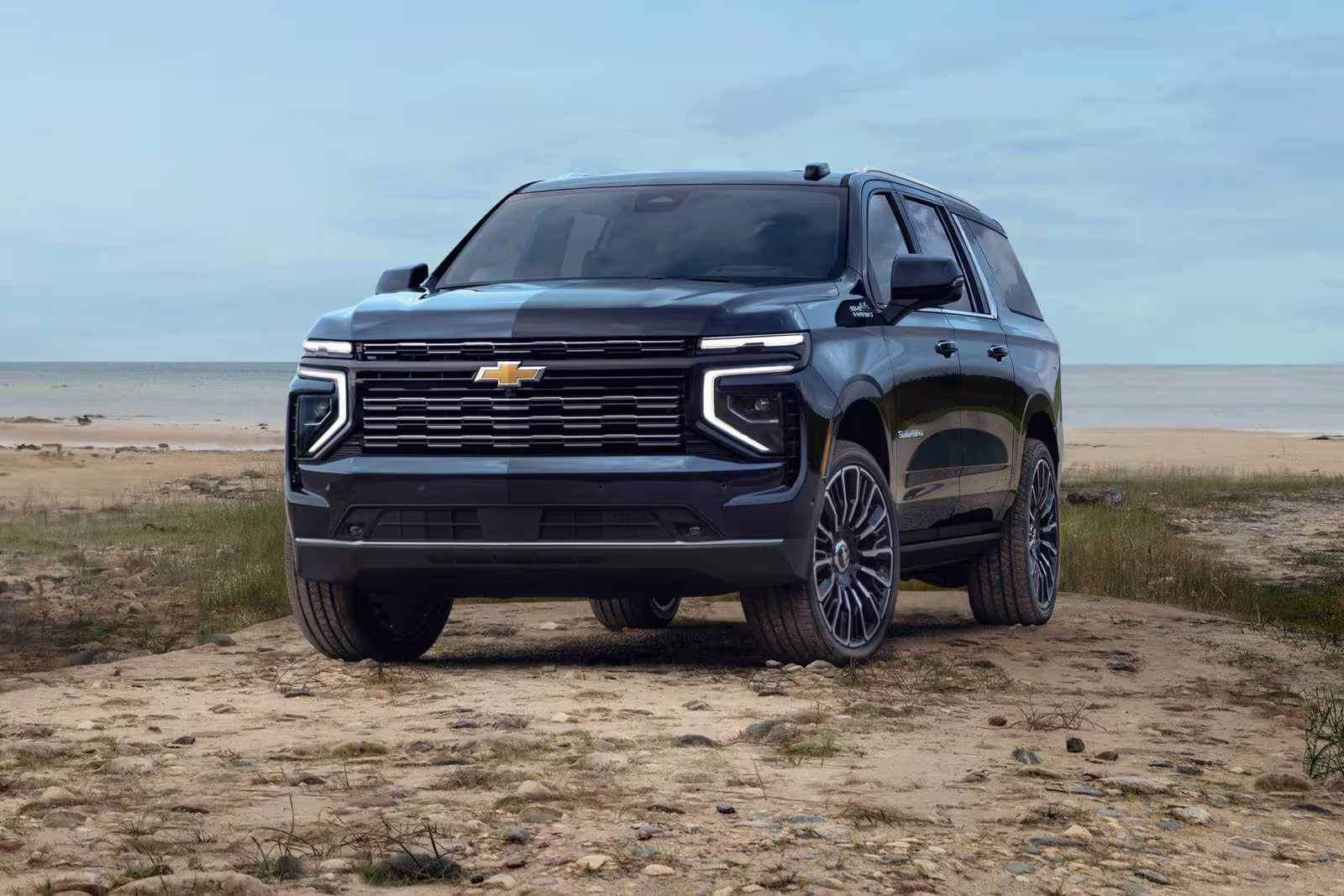 A black suv sitting parked.