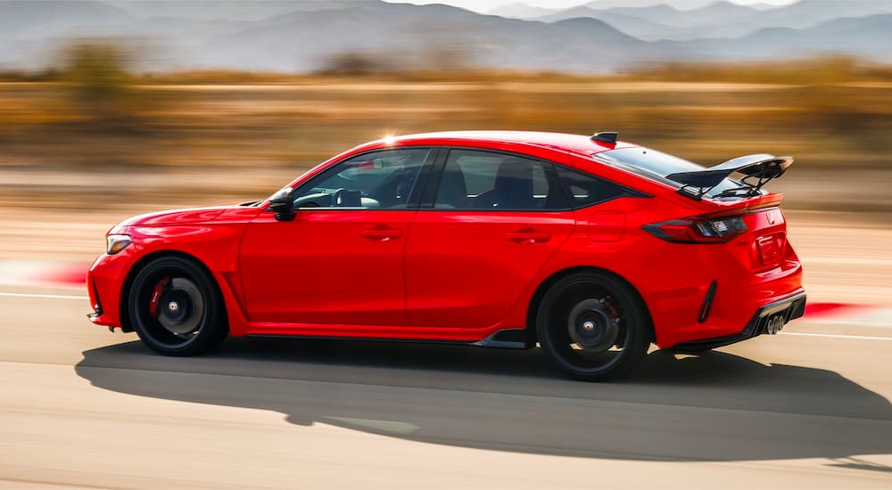 Red 2024 Honda Civic Type R driving on a track