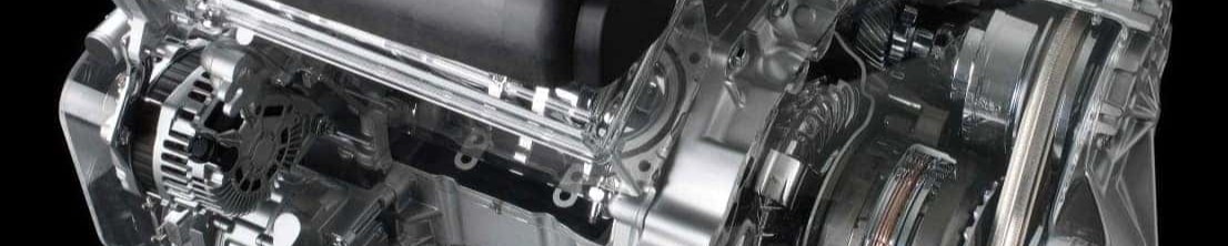Cutaway of a Nissan engine and CVT transmission on a black background