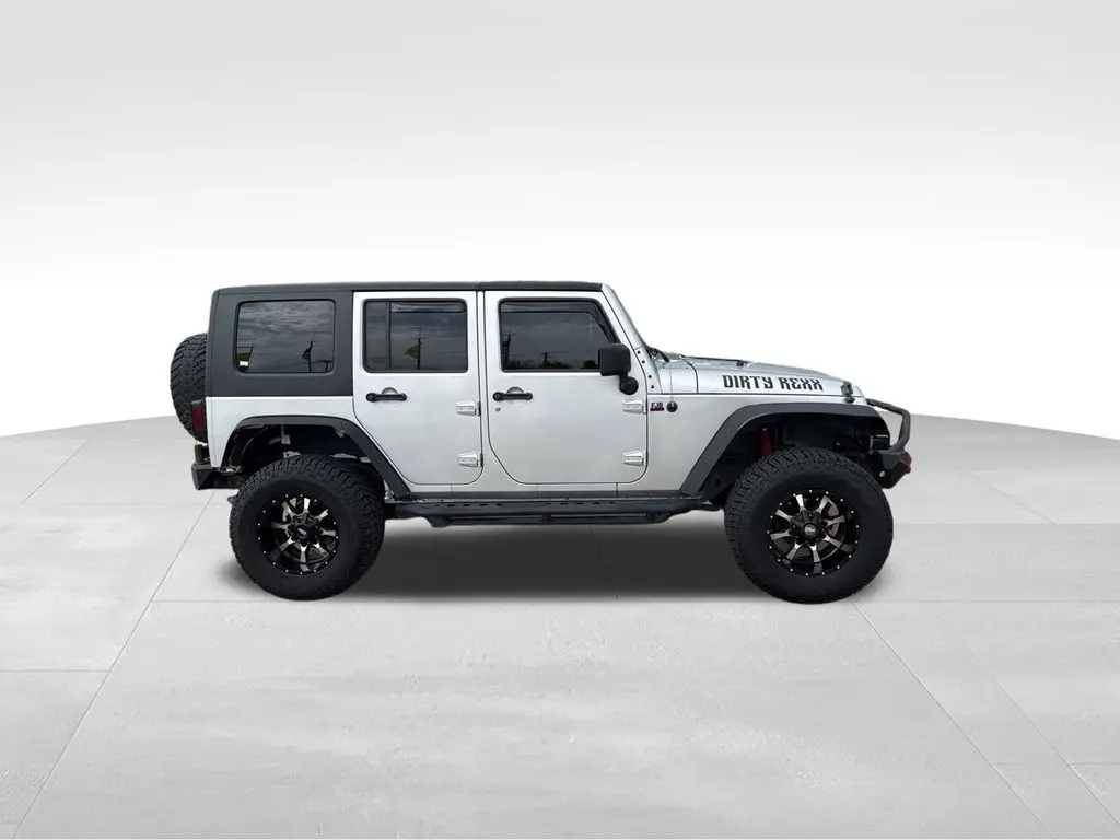 Used 2010 Jeep Wrangler Unlimited Sport with VIN 1J4BA3H1XAL102243 for sale in Davenport, IA