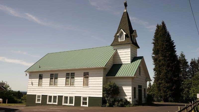 White wooden church with a steeple