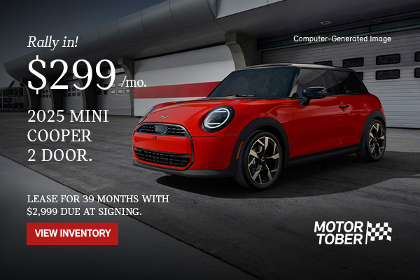 Front side view of MINI Cooper 2 Door parked in front of a garage. 