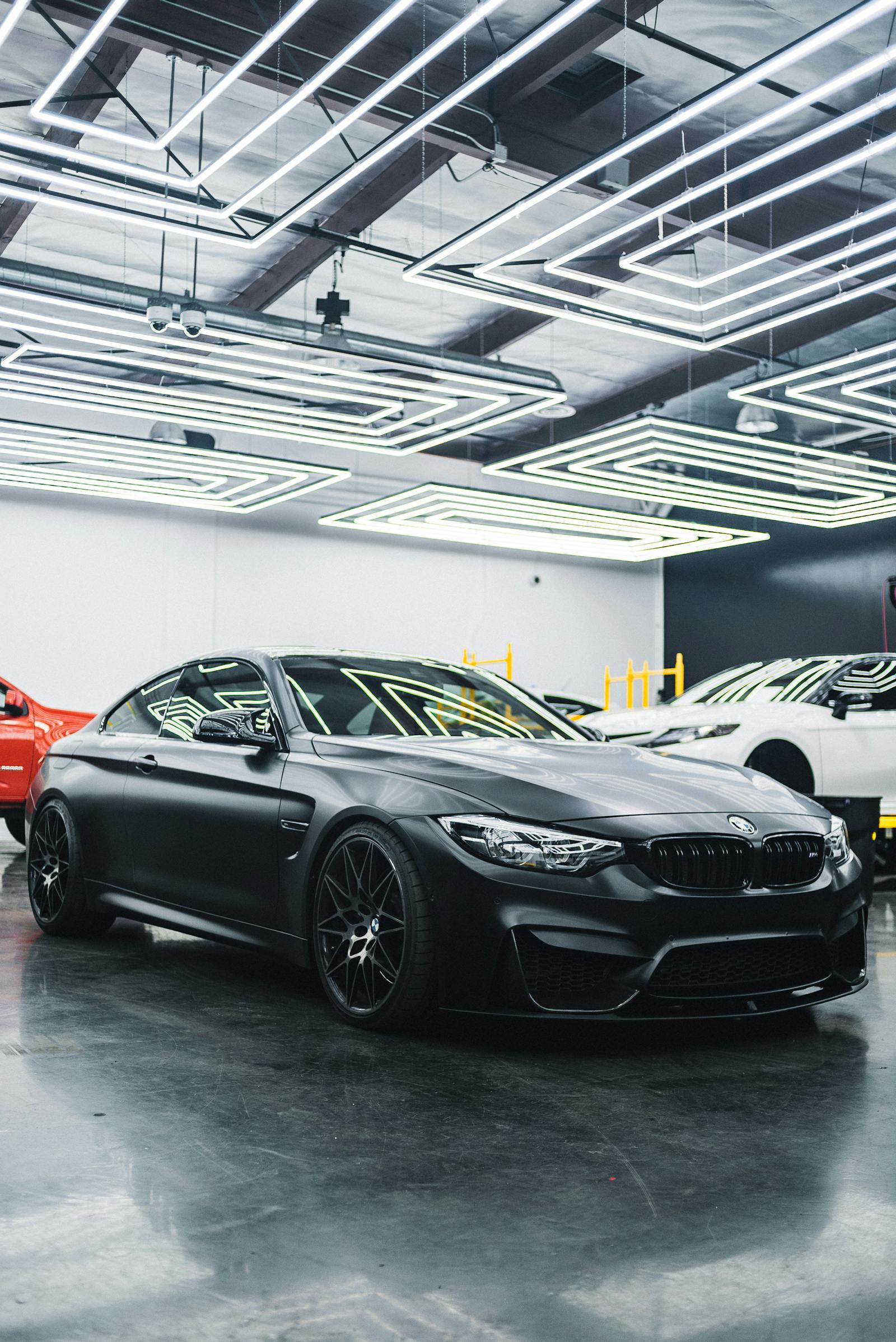 Customer signing finance documents at a dealership desk