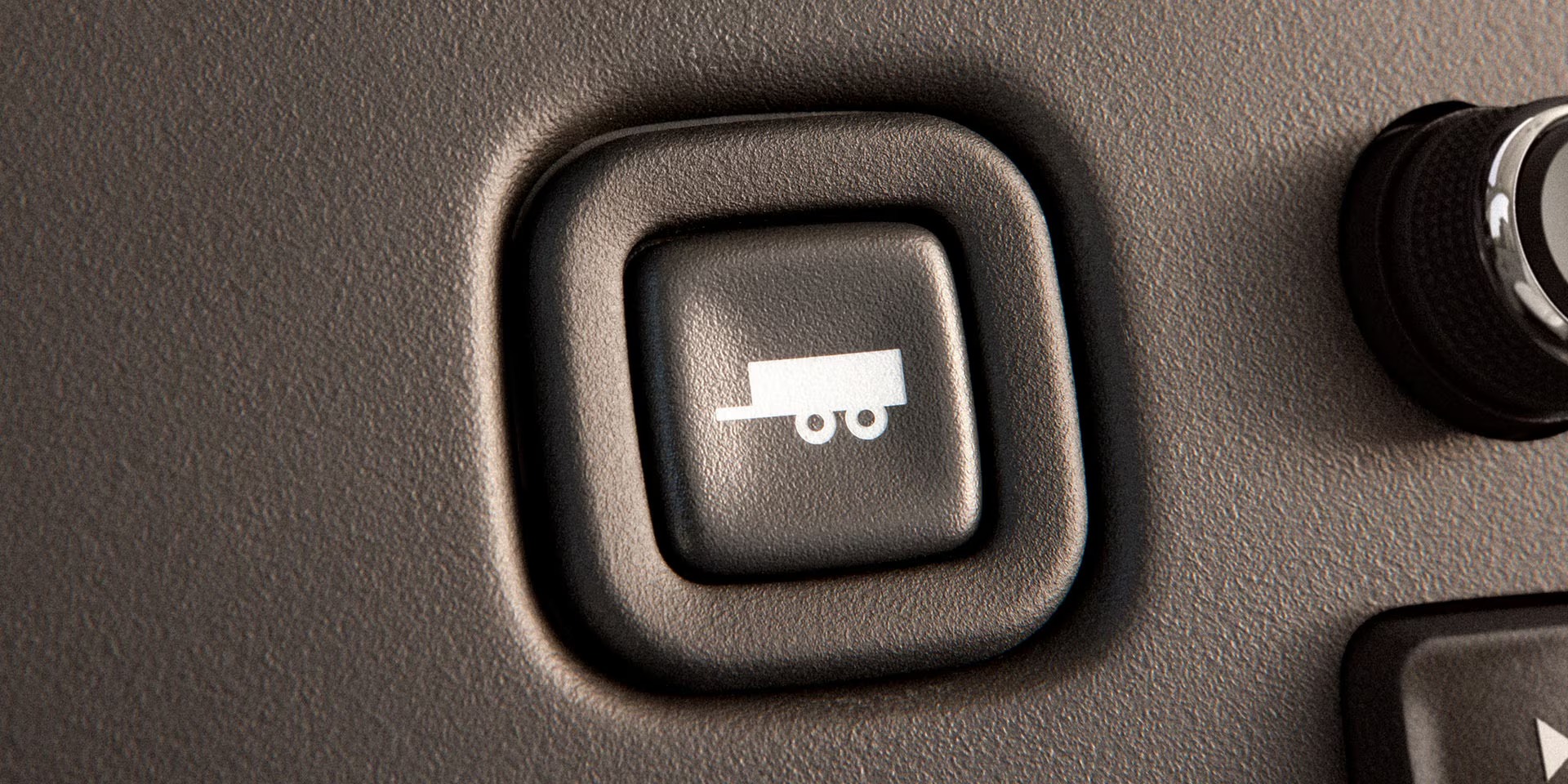 Tow/Haul mode button on the GMC Savana dashboard