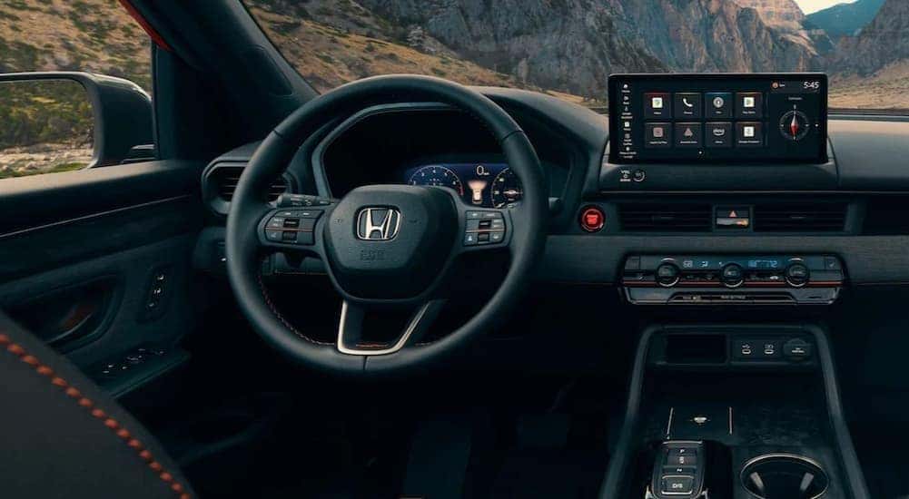 The black dash is shown in a 2026 Honda Passport TrailSport Elite.