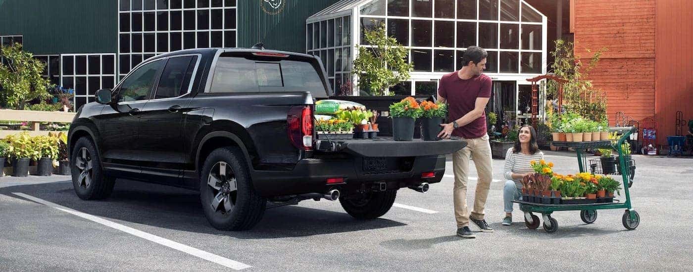 Black 2024 Honda Ridgeline at a flower shop