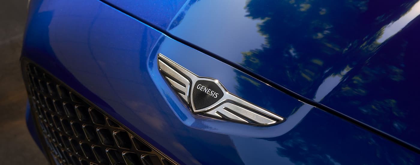 Genesis Emblem on a blue 2026 Genesis G70