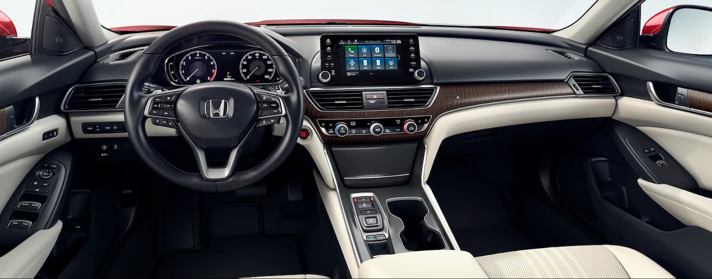 Interior dashboard and steering wheel are shown inside a 2020 Honda Accord