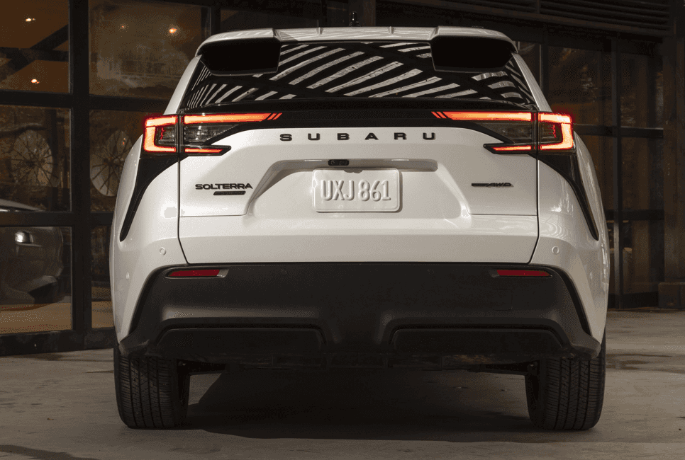 Rear view of a white 2026 Subaru Solterra showing its full-width taillights