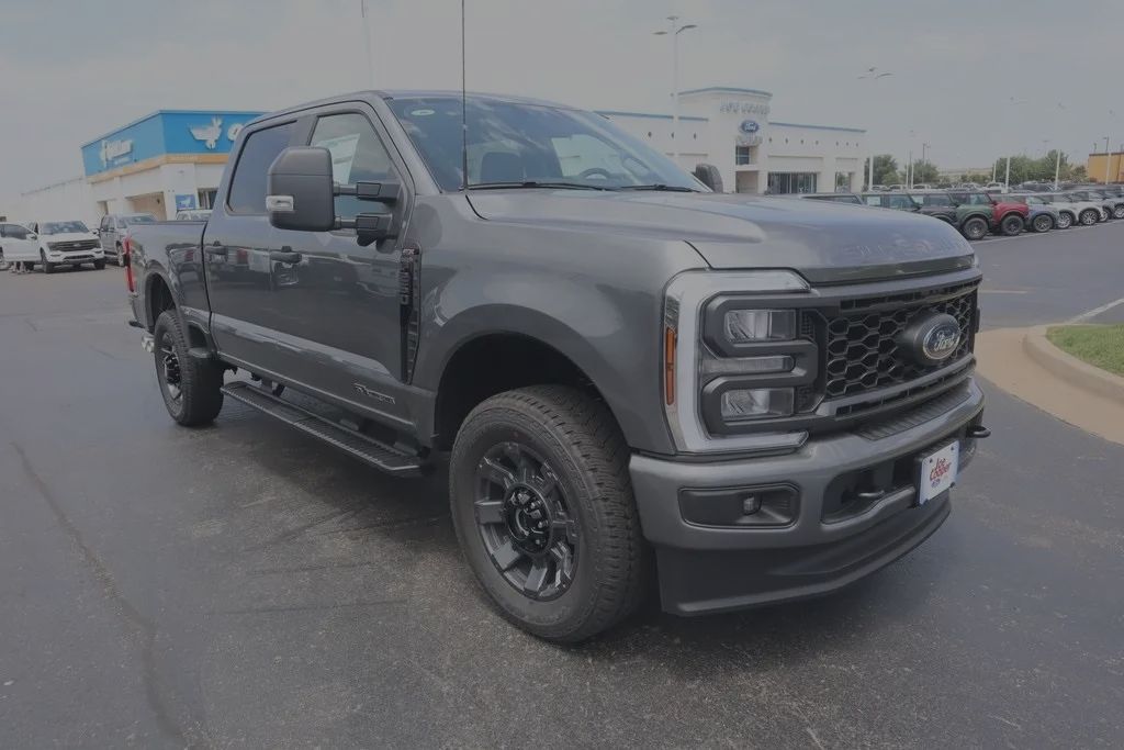 Ford F-250 Super Duty pickup truck available at Joe Cooper Ford of Yukon, Oklahoma, engineered for strength, towing, and durability. Features powerful engine options including a 6.7L Power Stroke V8 turbo diesel producing up to 475 horsepower and 1,050 lb-ft of torque, or a 7.3L V8 gas engine with 430 horsepower, both paired with a 10-speed automatic transmission for smooth power delivery. Offers maximum towing capacity around 20,000 pounds with gooseneck or fifth-wheel setups, payload capacity over 4,200 pounds, and average fuel economy between 15 and 20 miles per gallon with available fuel tanks up to 34 gallons. Built with a military-grade aluminum-alloy body, bold chrome grille, LED headlights, and available 20-inch wheels for a commanding presence. Interior includes seating for up to six passengers with trims from XL to Platinum and Limited, advanced tech like SYNC 4 with a 12-inch touchscreen, Apple CarPlay, Android Auto, premium B&O sound system, wireless charging, and multiple USB ports. Safety systems include Ford Co-Pilot360 with adaptive cruise control, blind spot monitoring, lane keeping assist, trailer sway control, and pre-collision assist. Convenience features include Pro Trailer Backup Assist, integrated trailer brake controller, and selectable drive modes for Tow/Haul, Off-Road, and Snow conditions. Available in Regular Cab, SuperCab, and Crew Cab configurations with 4x2 or 4x4 drivetrains. Financing options at Joe Cooper Ford of Yukon include low APR offers on select new F-250 models, flexible loan terms, trade-in support, and online pre-qualification with no impact on credit, helping Oklahoma drivers customize payments to fit their budget while taking advantage of limited-time Ford specials.