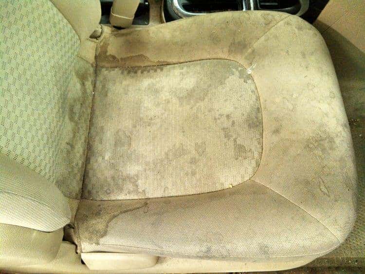 Heavily stained cloth car seat