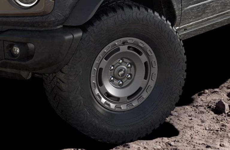 Close Up of 2025 Ford Bronco Sasquatch Package Wheels on Dirt Trail