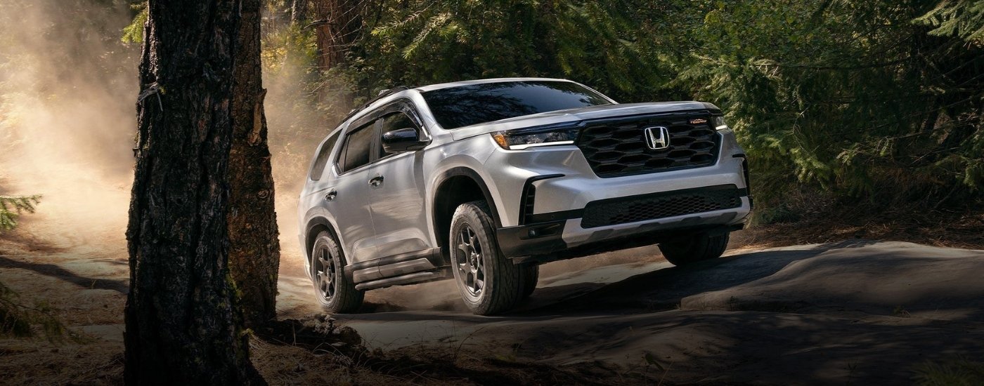 Silver 2025 Honda Pilot TrailSport off-roading
