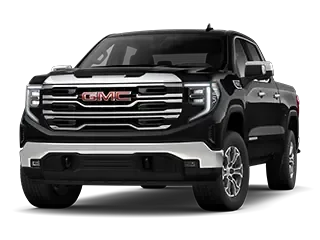 Front three-quarter studio view of a black GMC pickup truck with a legible GMC grille badge and chrome trim, on a white background