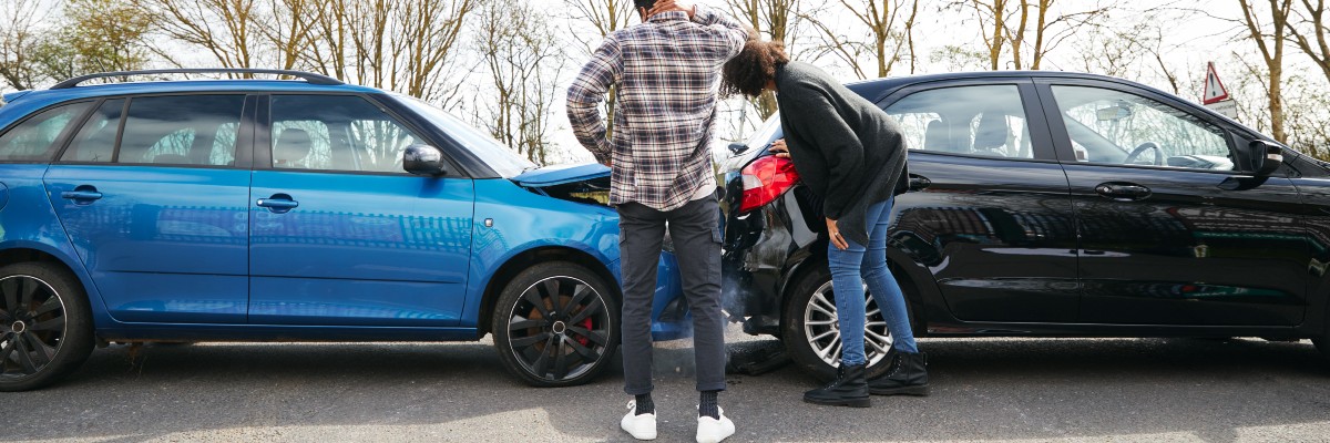 Individuals Involved in Incident Inspect Injured Vehicles
