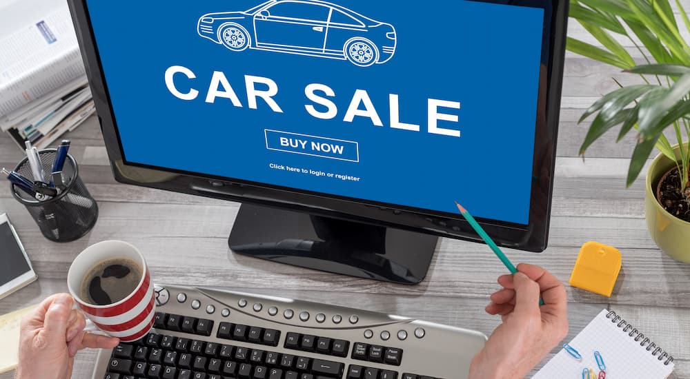 Computer monitor with "car sale" displayed.