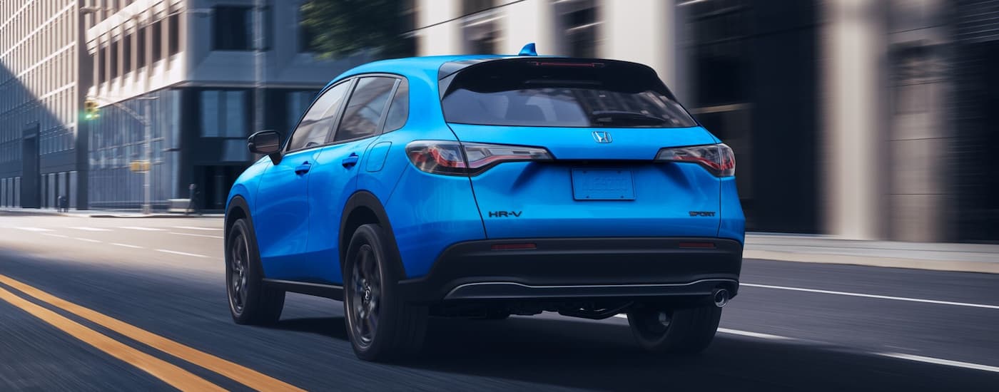Blue 2026 Honda HR-V driving on a city street