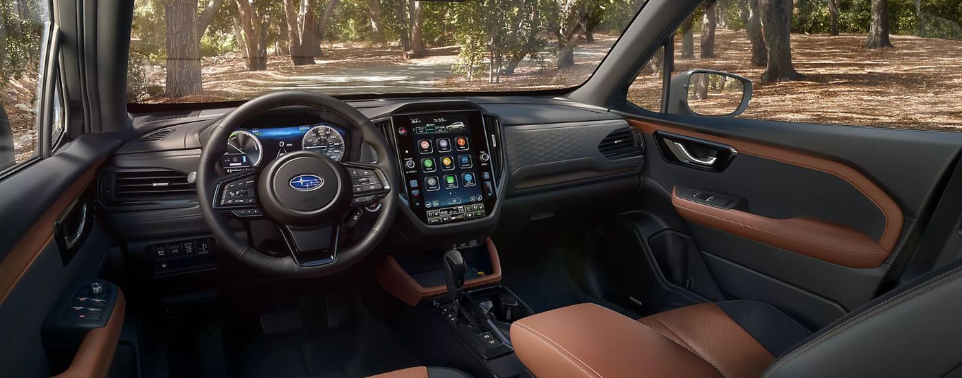 Brown and black leather interior of a 2026 Subaru Forester Touring Hybrid.
