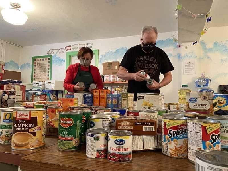 Volunteers sorting canned food at the West Linn Food Pantry