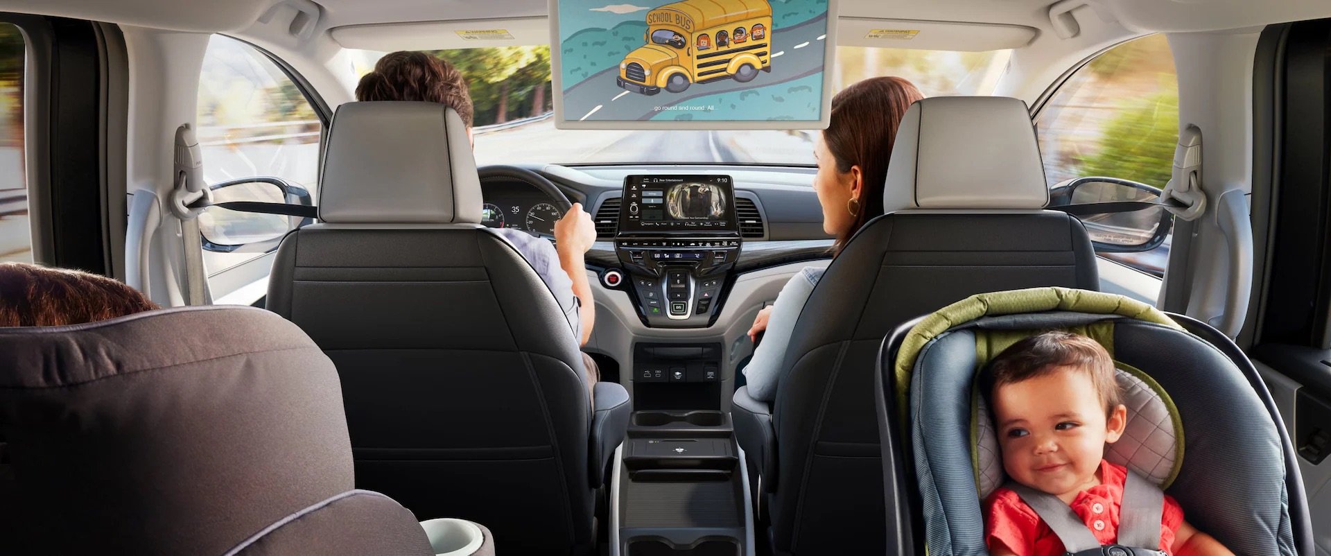 family sitting inside a 2026 honda odyssey