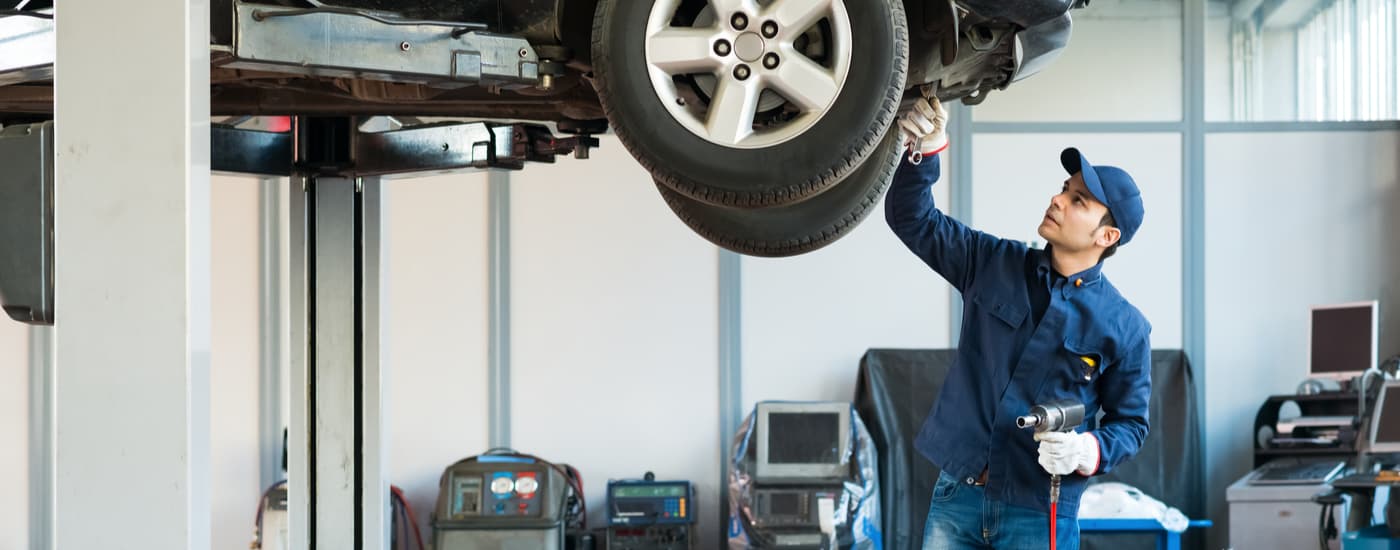 A Honda technician is shown doing diagnostics on a vehicle during a Honda Service in Rochester, NY.