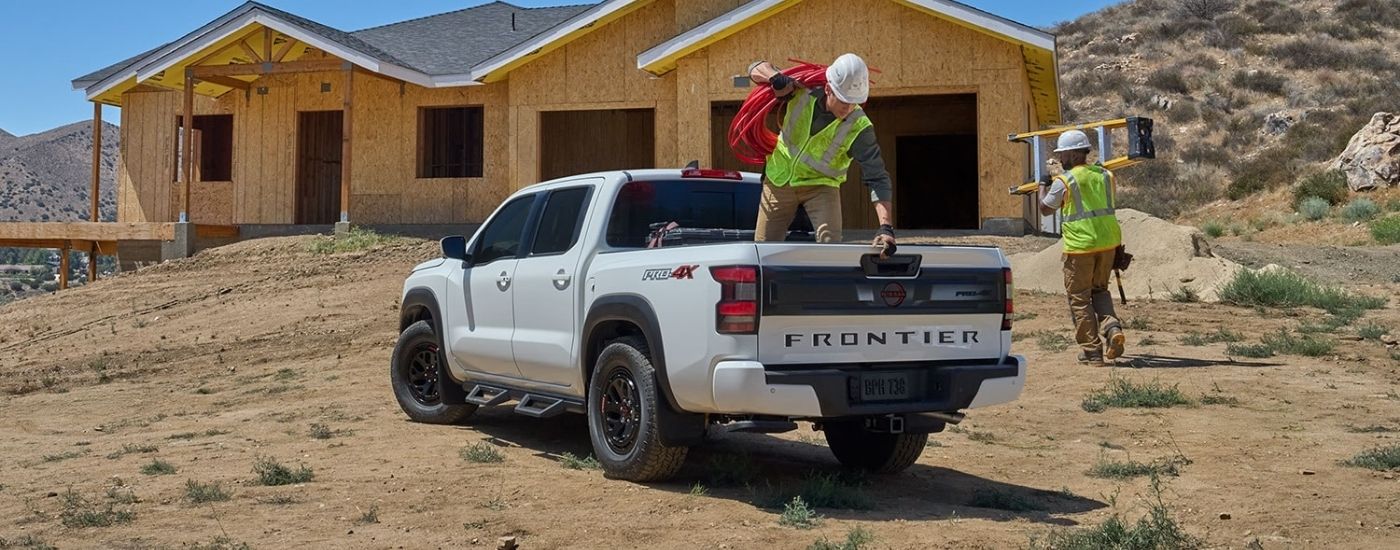 White 2026 Nissan Frontier PRO-4X at a construction site