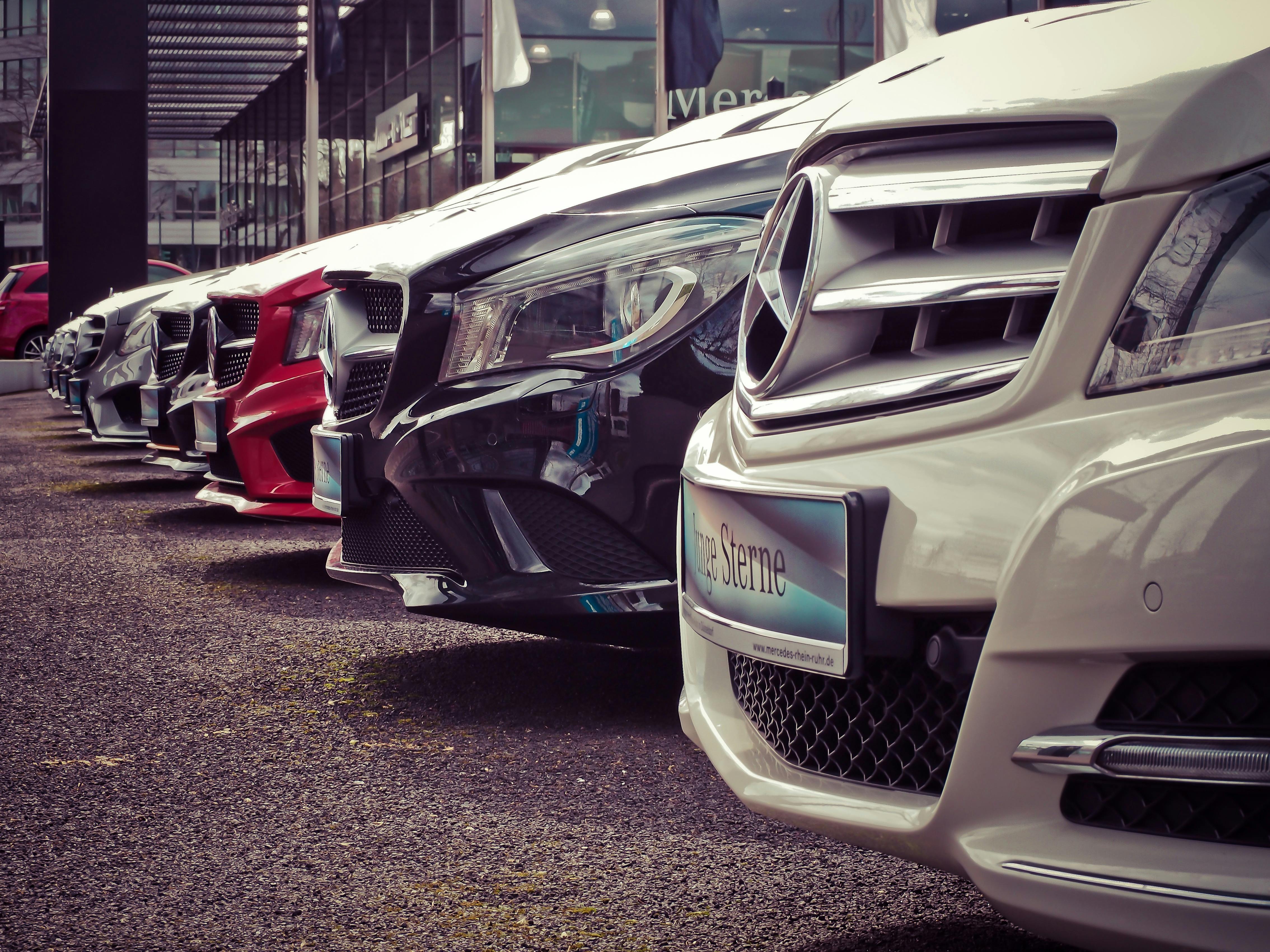 Row of vehicles in different colors at a showroom