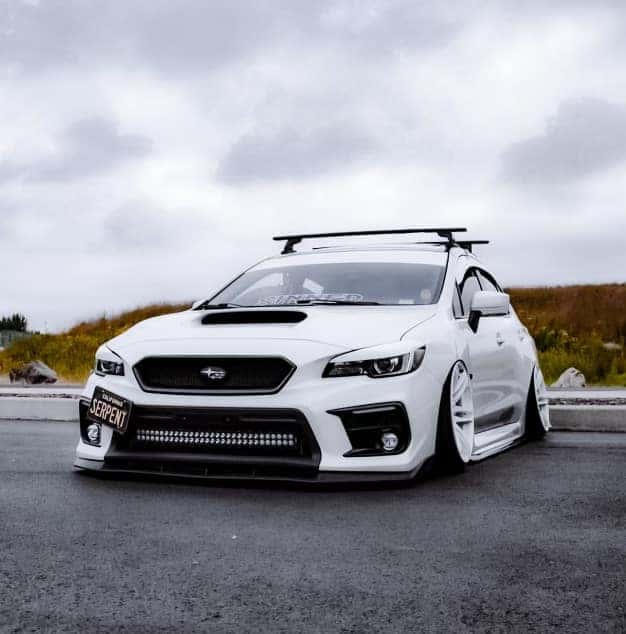 White Subaru WRX with a roof rack