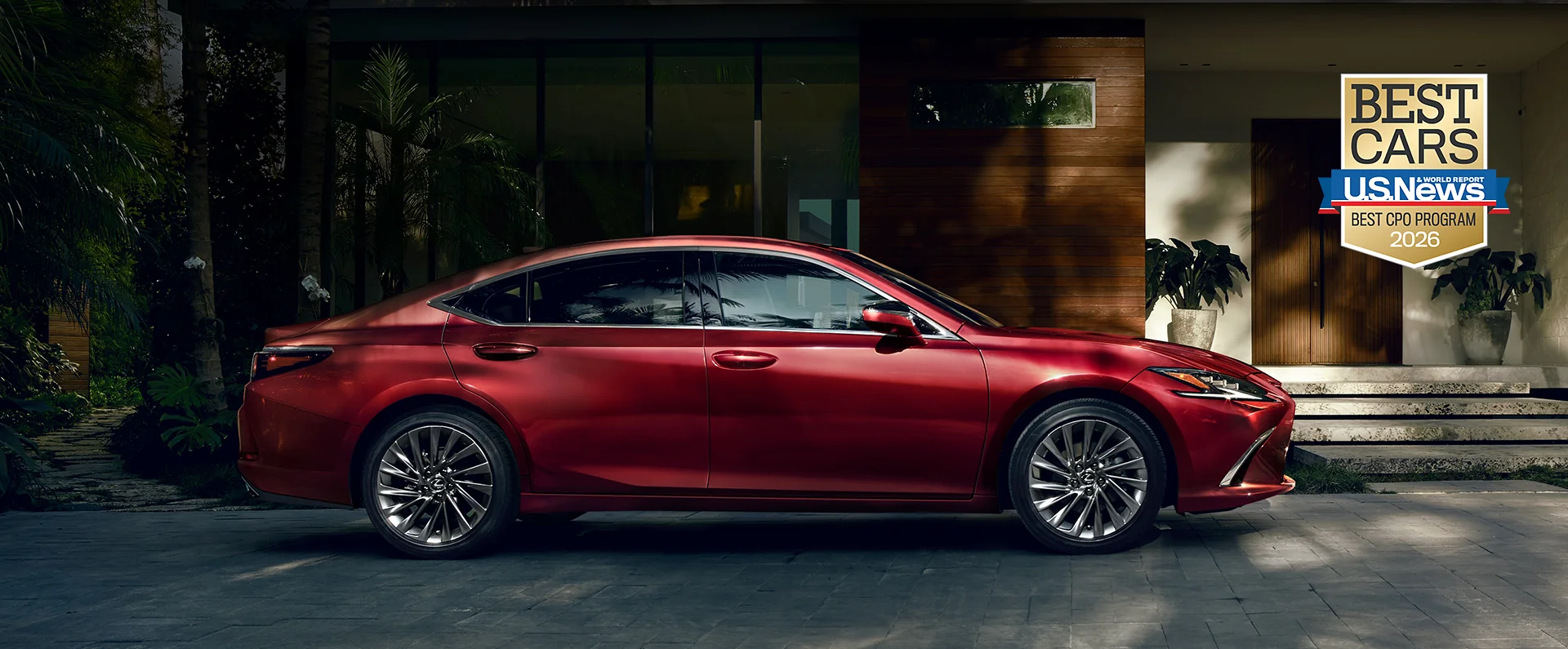 ES 350 shown in Matador Red Mica exterior color, with a U.S. News and World Report Best CPO Program badge in the background. 