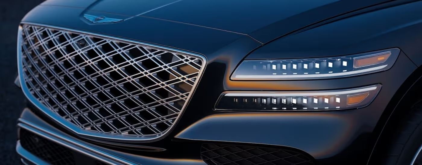 Close-up of the grille on a black 2025 Genesis GV80 for sale near Montgomery