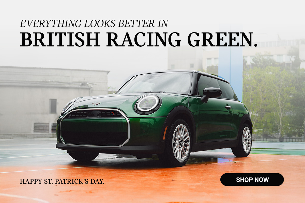 Green MINI 2 Door parked on a rooftop