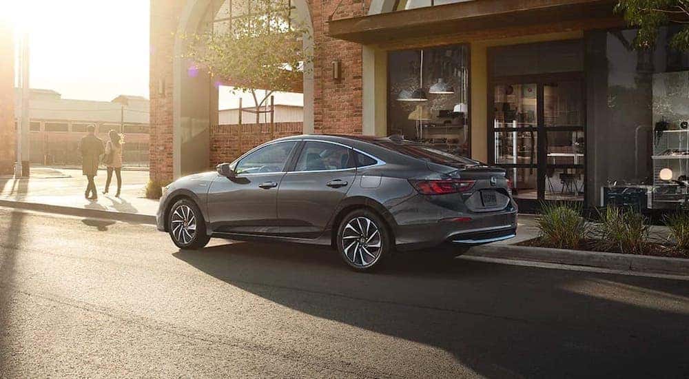 A gray 2020 Honda Civic Touring is parked on a city street near Rochester, NY.