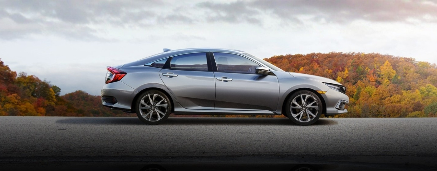 Silver 2020 Honda Civic overlooking trees