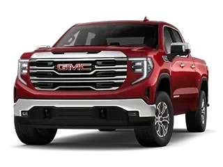 Front three-quarter studio view of a red GMC pickup truck with a legible GMC grille badge, chrome trim, and black wheels, on a white background