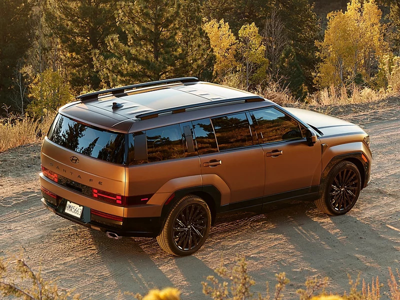 A brown suv sitting parked.