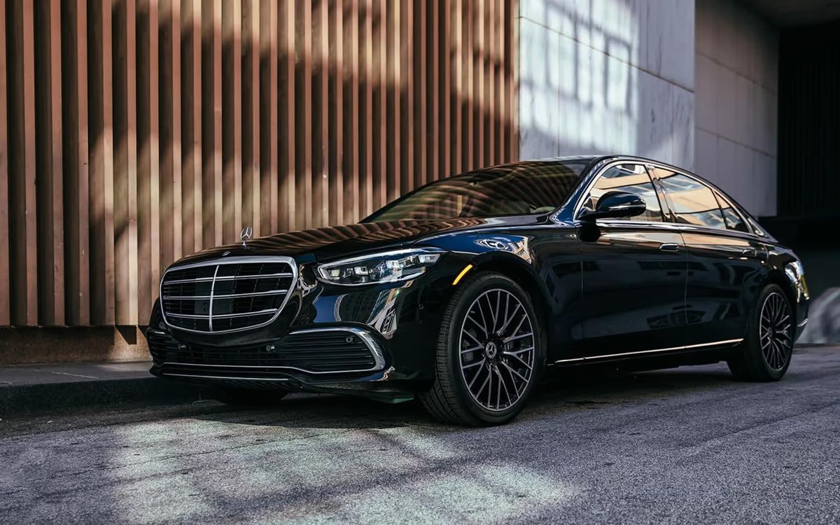2026 Mercedes-Benz S 580 in black, parked on a city street